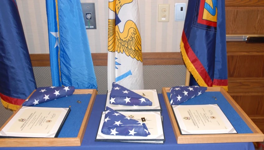 a room filled with flags and flags and some books