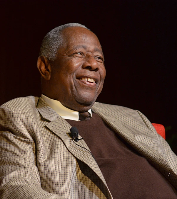 an older man wearing a suit and bow tie