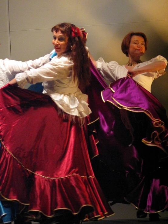 two people are dressed up as female dancers