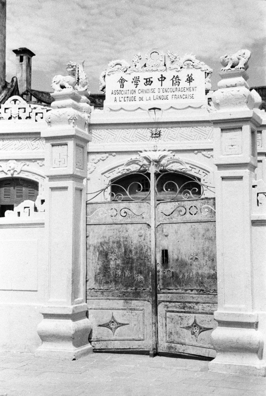 an old, antique chinese building with two doors