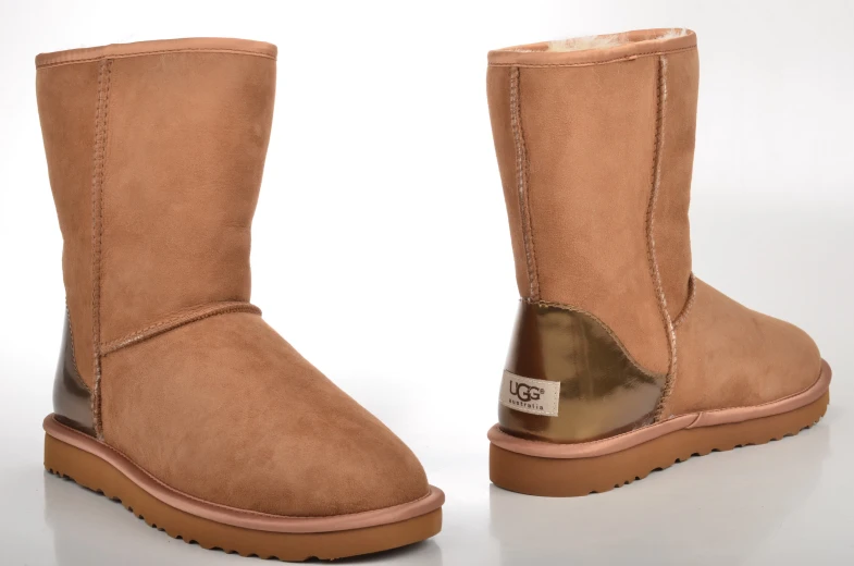 a pair of ugg's shoes on a white surface