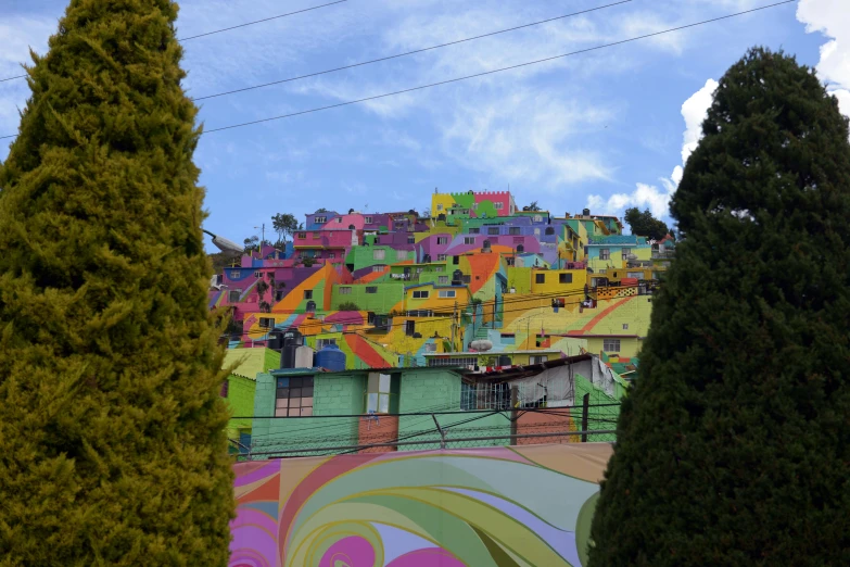 a building with lots of colorful designs painted on the side