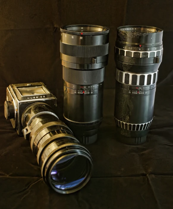 two lens cups sitting next to a larger one