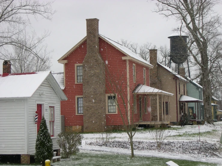 a house with red brick and a water tower