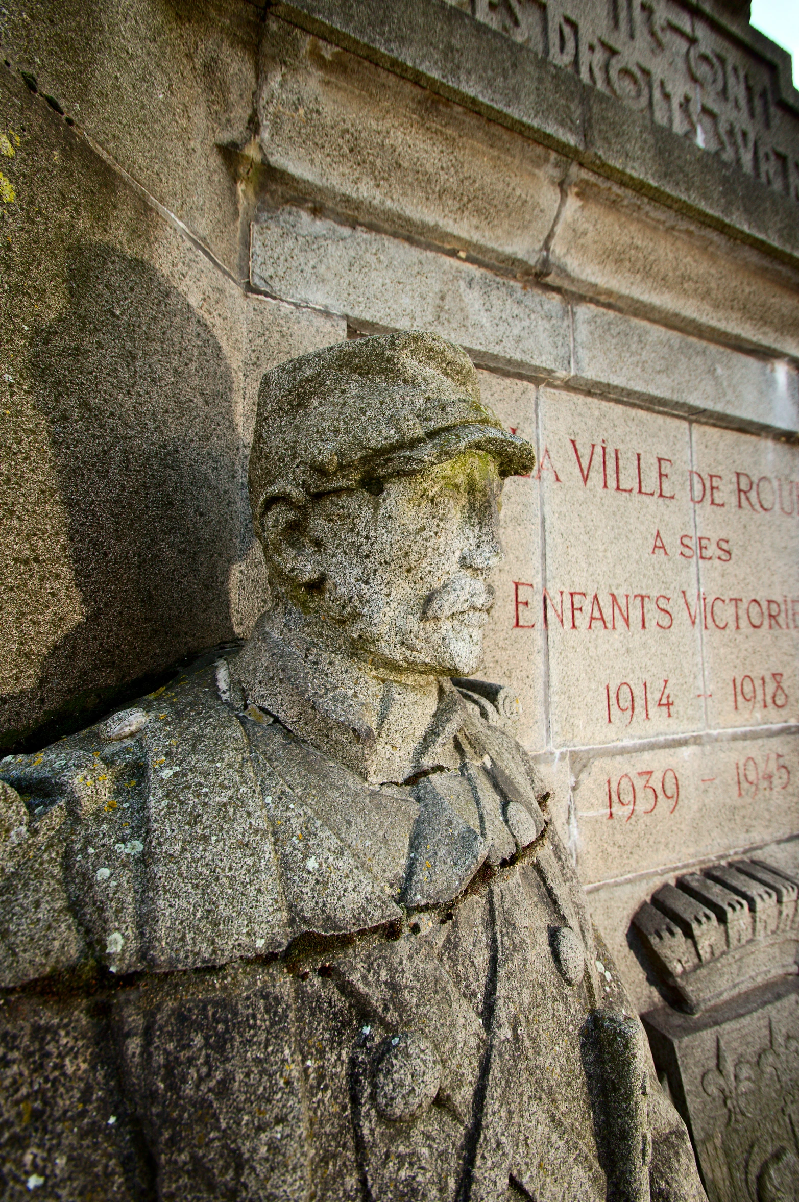 a close up view of a stone statue on a wall