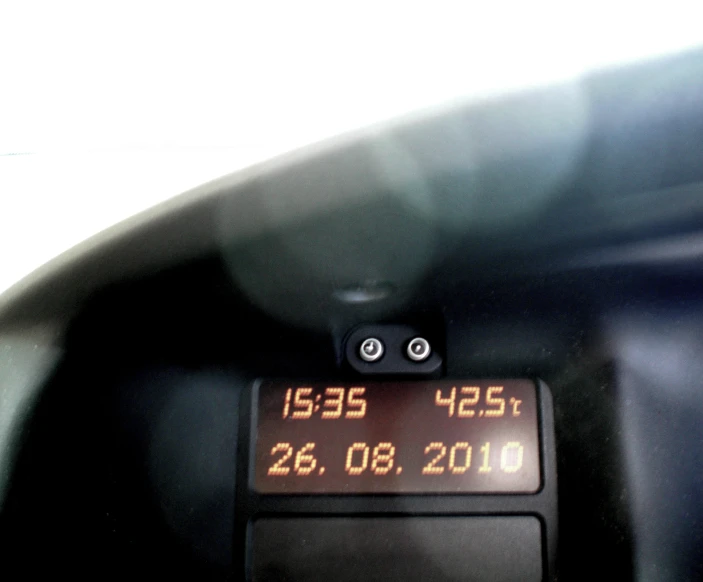 there is a small digital time displayed on the front of a vehicle