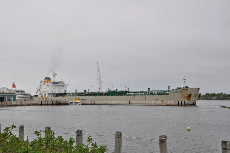 a large ship is docked at the pier