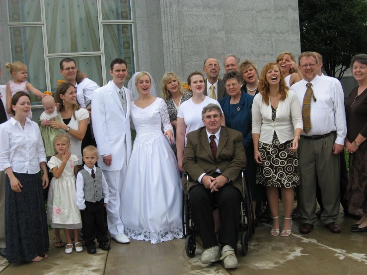 the family is wearing dresses for a wedding