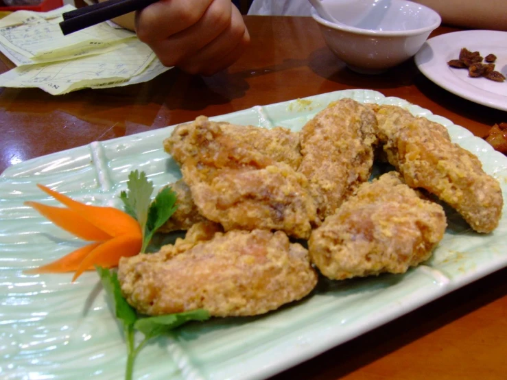 a plate of chicken is on a table