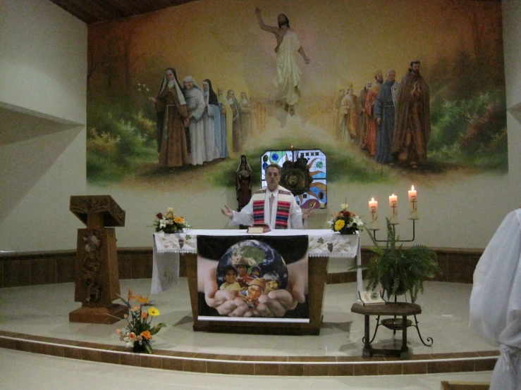 the priest is standing at the alter of the church