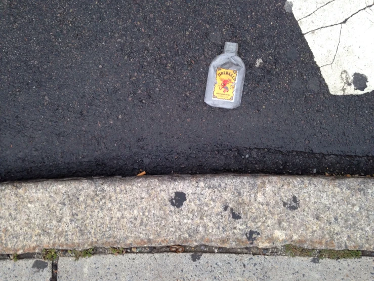 a bottle of water on the side of a road