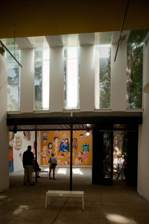 an entrance way at a museum with people standing near it