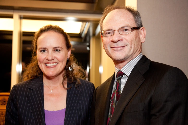 a man and a woman standing next to each other