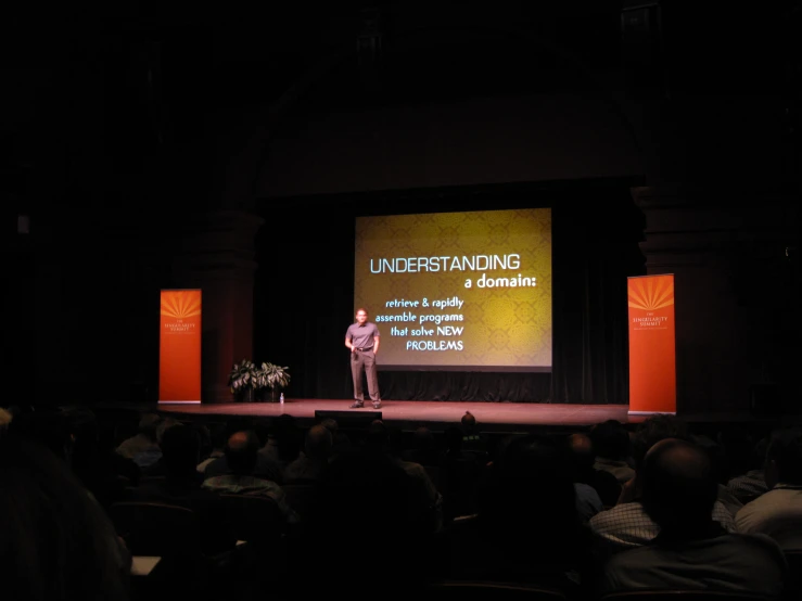 a person on stage with a presentation about self - centered living