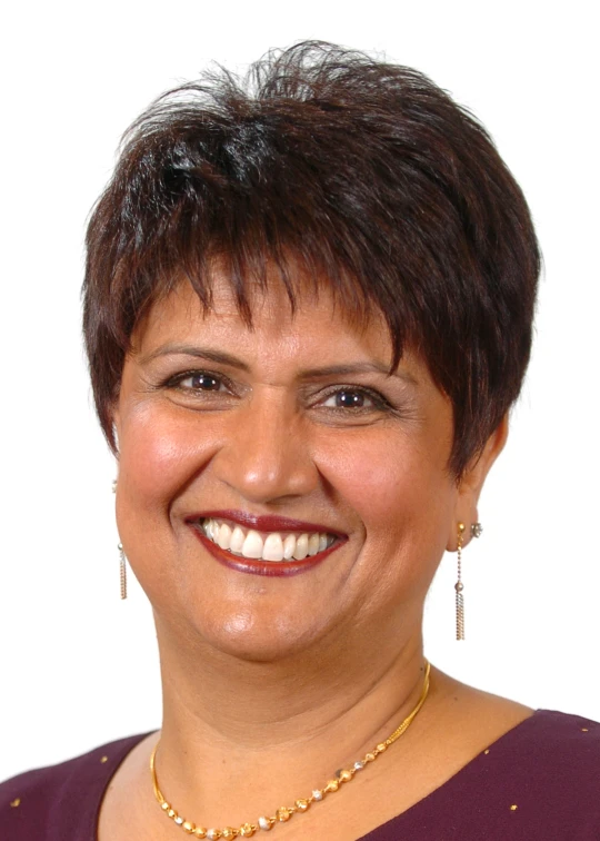 a woman in red shirt smiling for camera