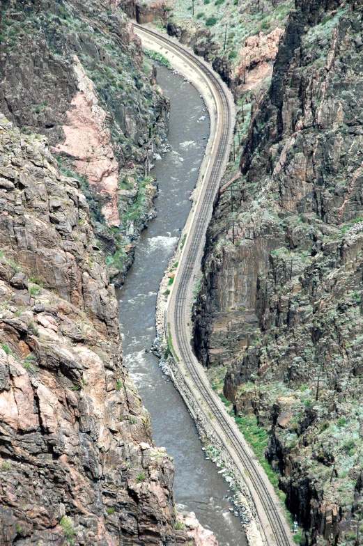 a canyon that has a winding river running through it