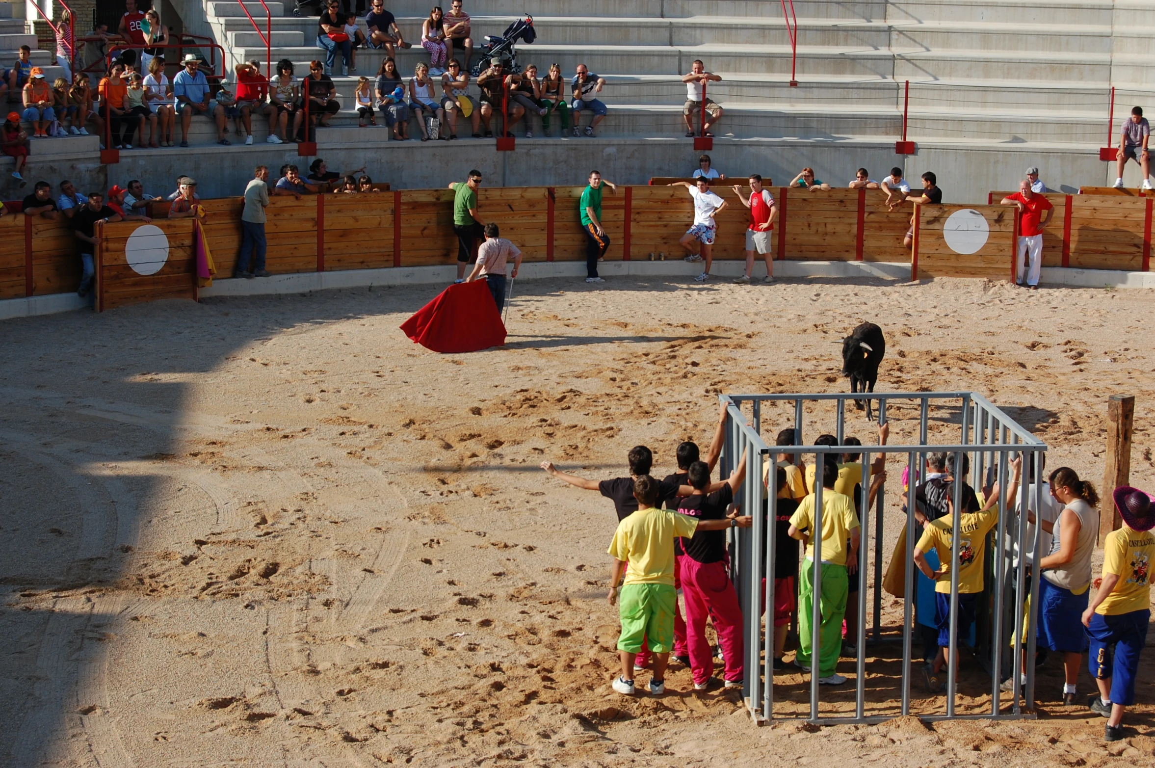 a crowd of people standing around a gate