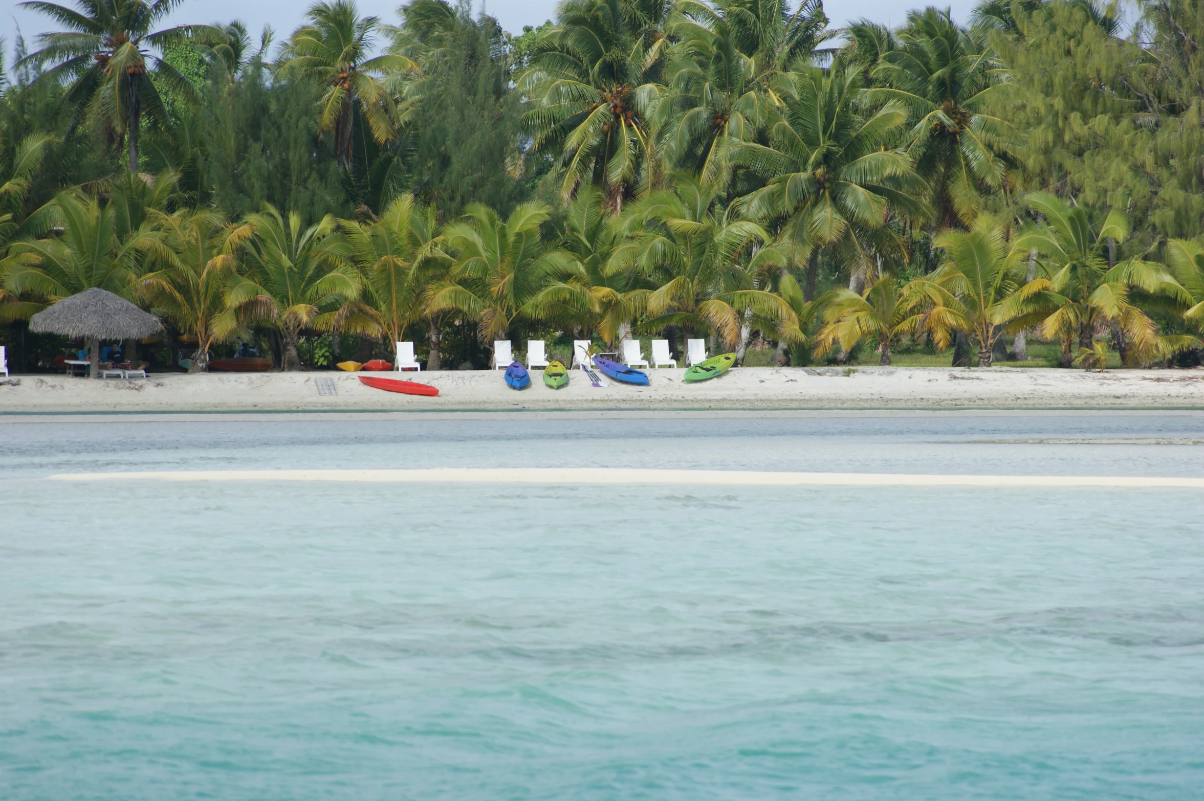 a group of small boats docked on the water