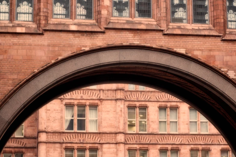 archway to a building with windows in between