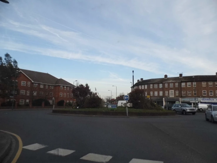 a stop sign is seen on a quiet street corner