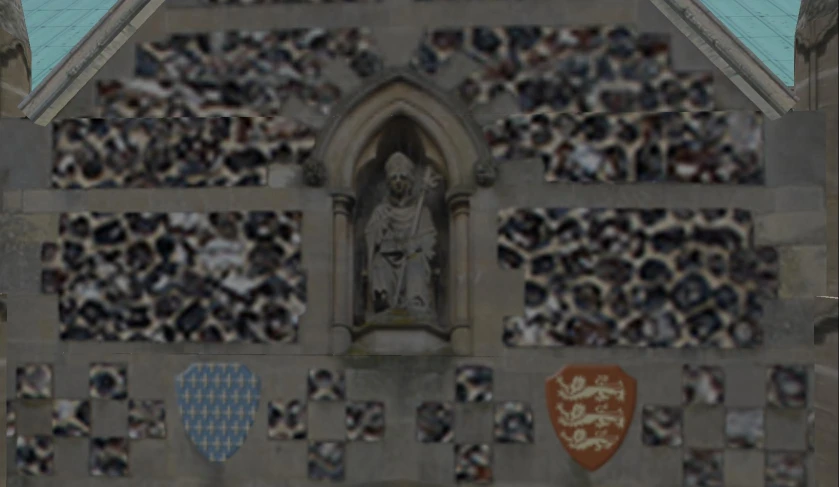 an image of a very old building with some statues