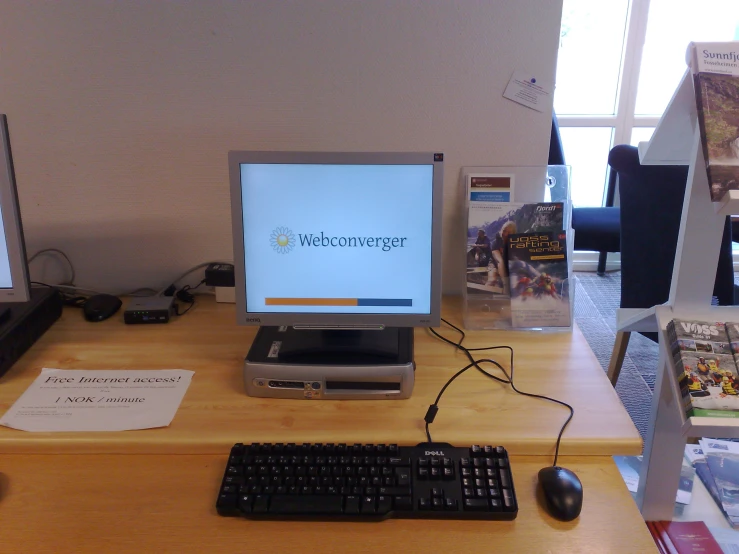 a desk with a computer and a keyboard