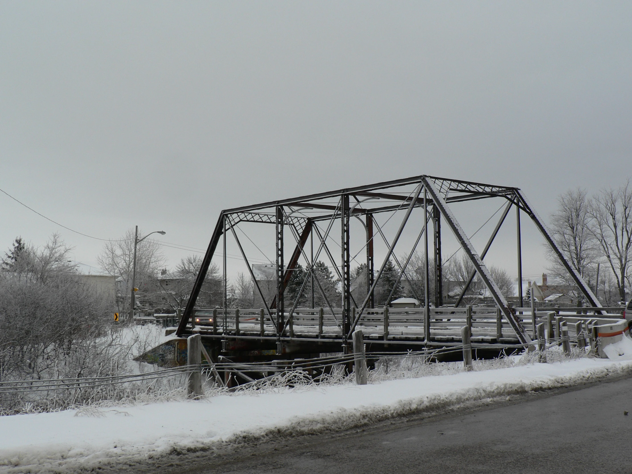 a street with a bridge in the middle of it