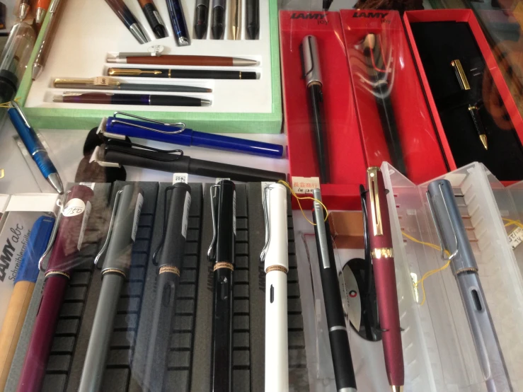 pens and pencils are lined up together