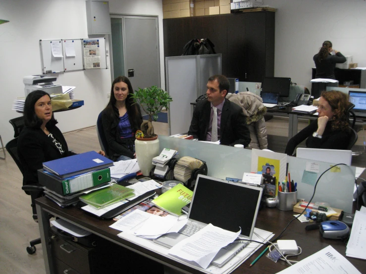 a group of people working in an office