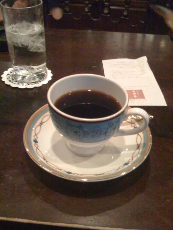 a cup of coffee sitting on top of a saucer