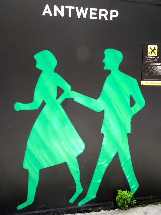 this sign depicts two people walking against each other