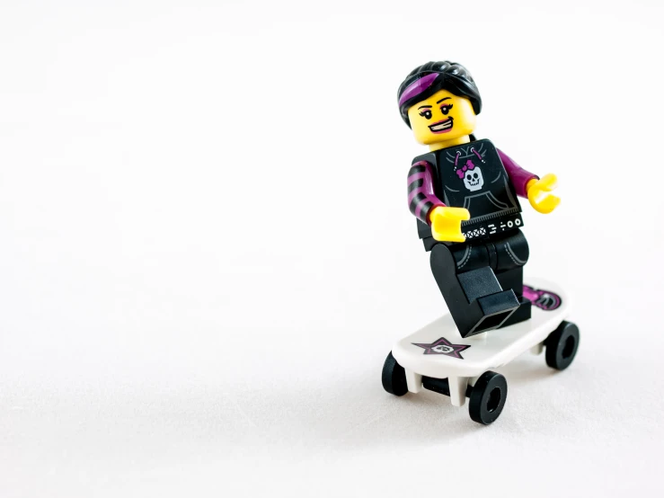 a lego figure is standing on top of a skateboard