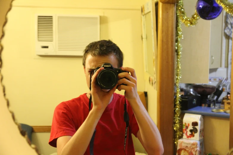 a man taking a po in front of a mirror