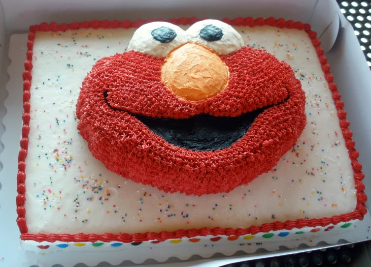 an elmo cake in a box for the birthday boy
