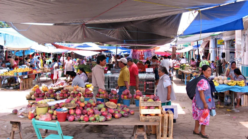 the fruit stand is full of fruits for sale