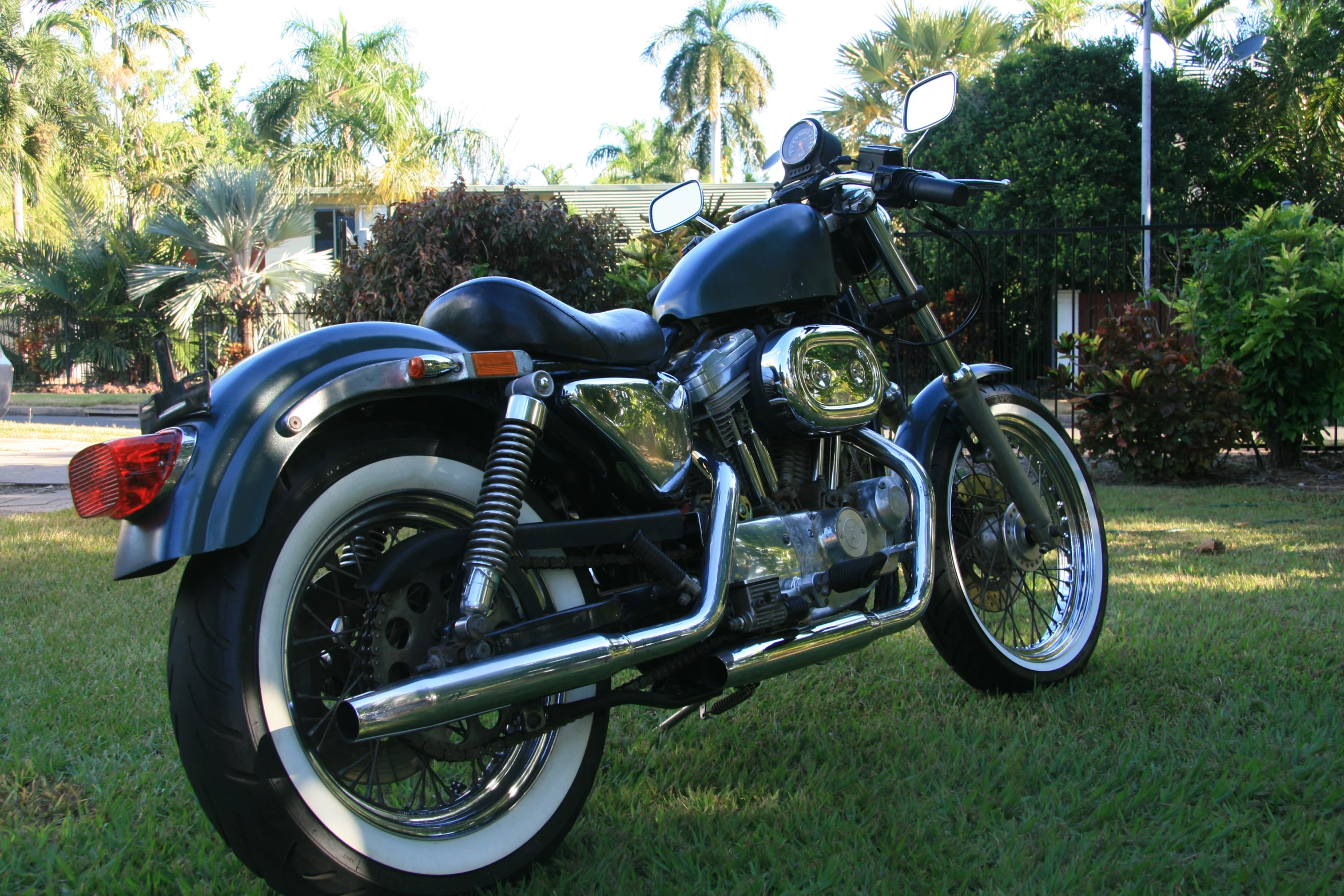 a motorcycle that is parked on some grass