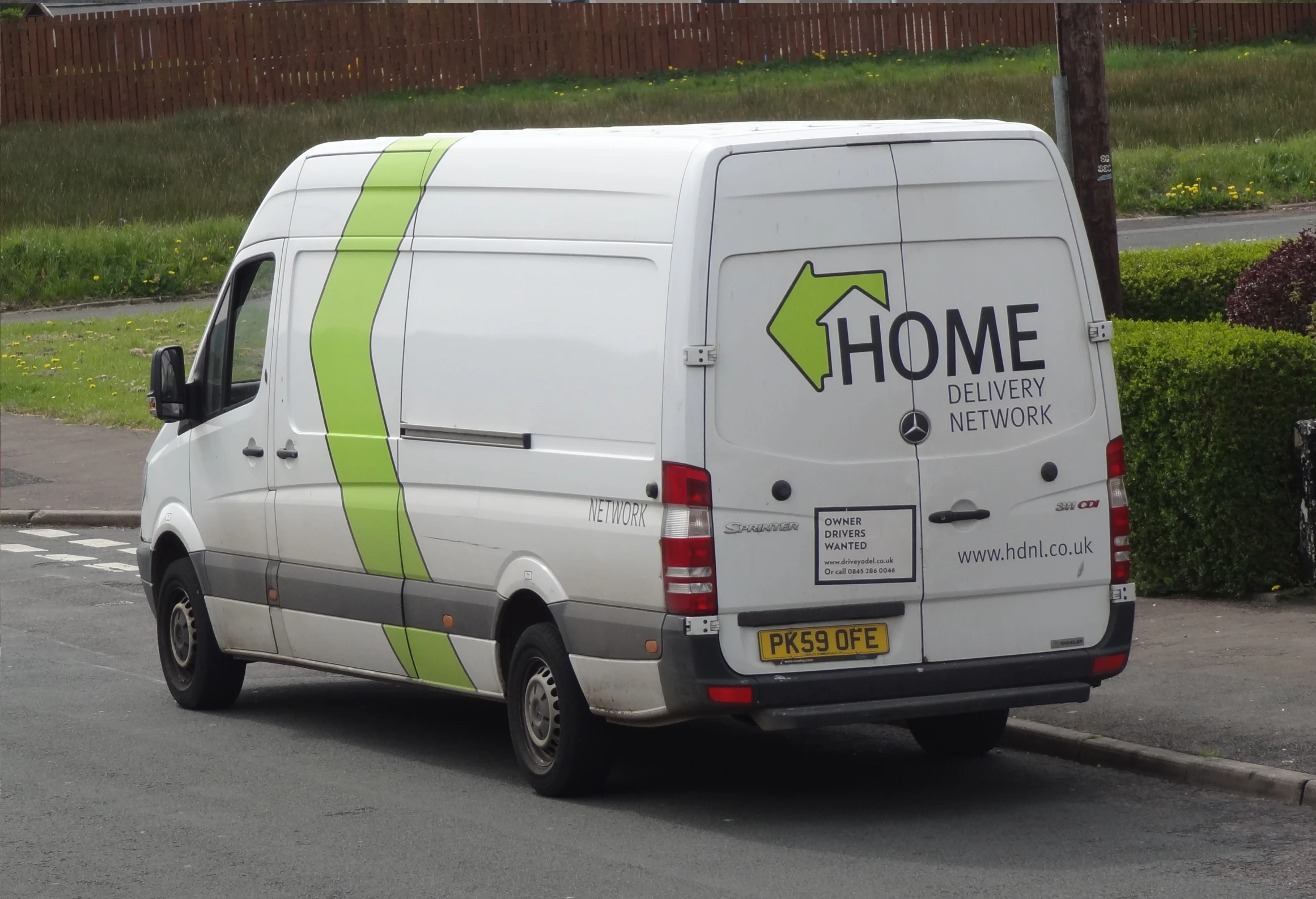 a white van parked on the side of a road