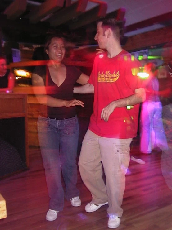 two young men and a woman at a party