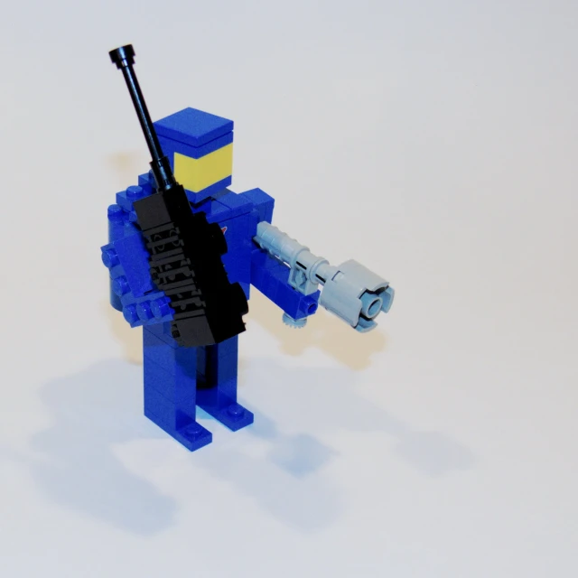 a lego soldier that is holding a weapon