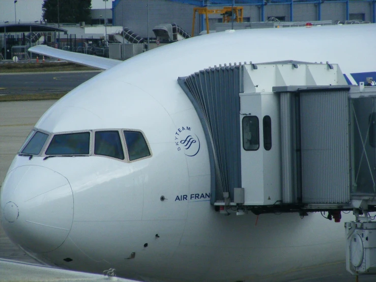 an airplane with its door open at the terminal