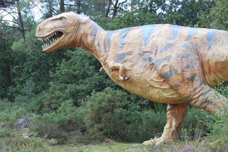 the large inflatable dinosaur has long, sharp teeth
