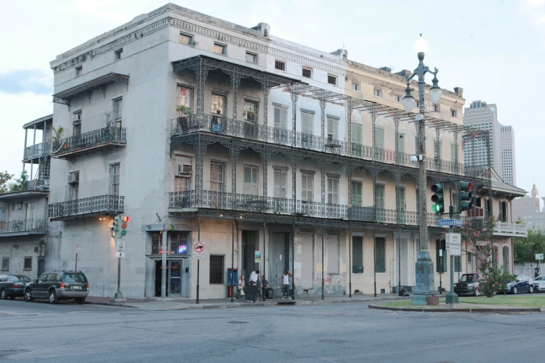 an empty building has multiple balconies and lights on top