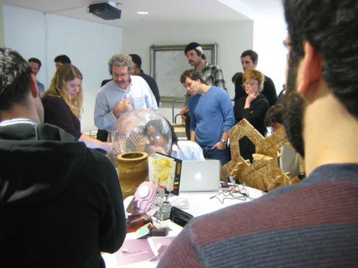 people crowded together at an event in a room