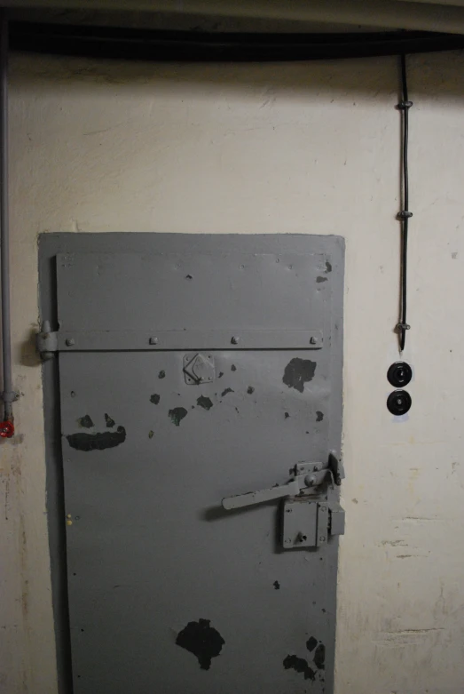 a white refrigerator freezer sitting inside of a bathroom