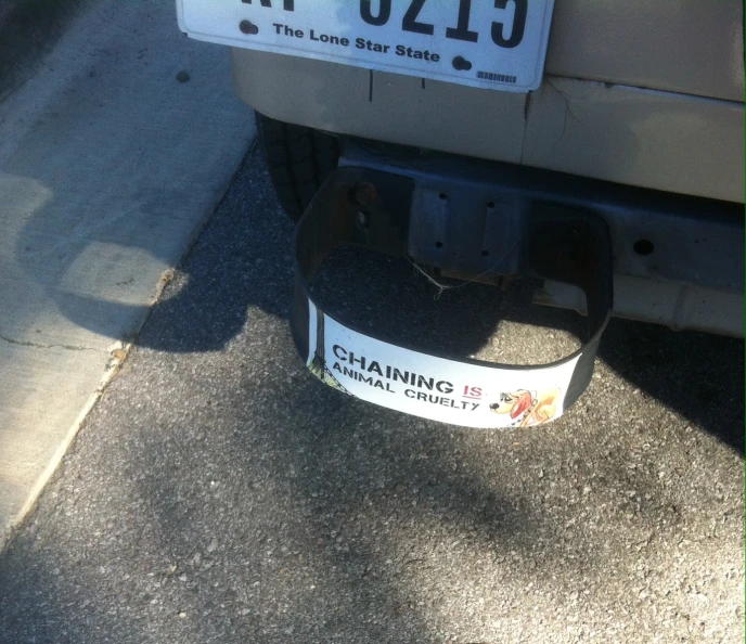 the name plate of a parked vehicle that has been modified