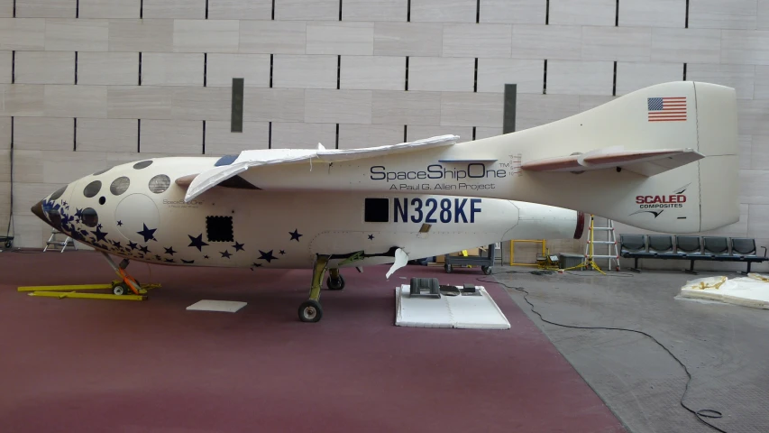 an airplane painted like a rocket ship is on display
