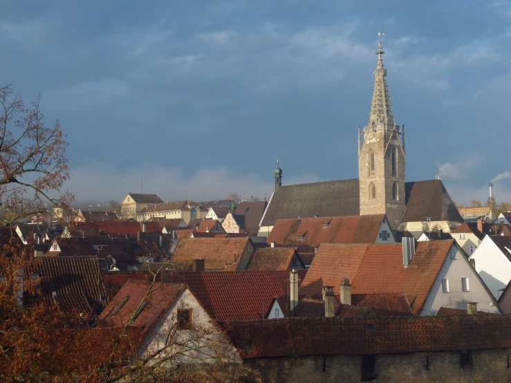 a city with a tall tower with an spire in the middle