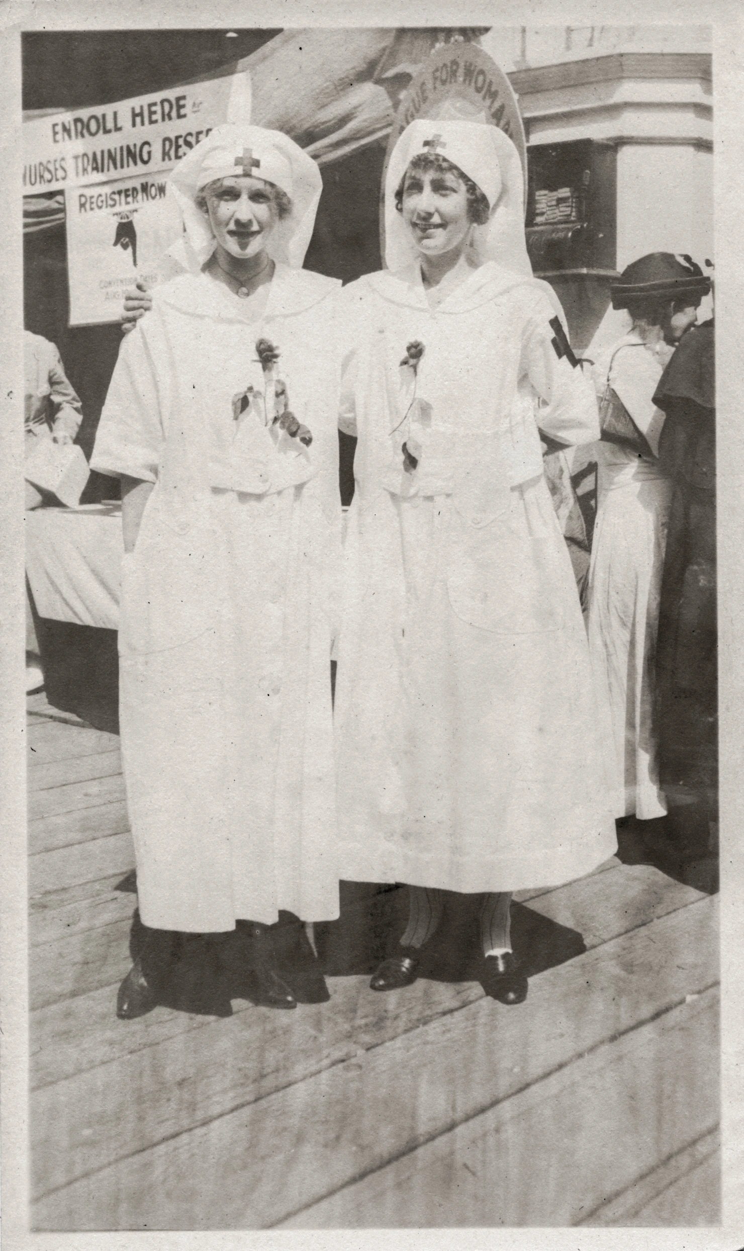 two women dressed as people in costumes on a dock