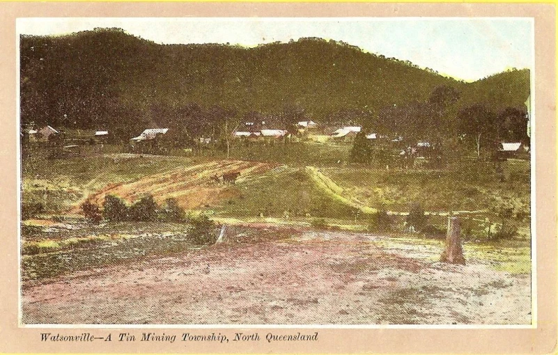 an old postcard showing the road leading to the mountains