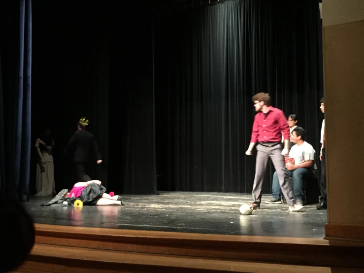 people on stage with a man and a woman